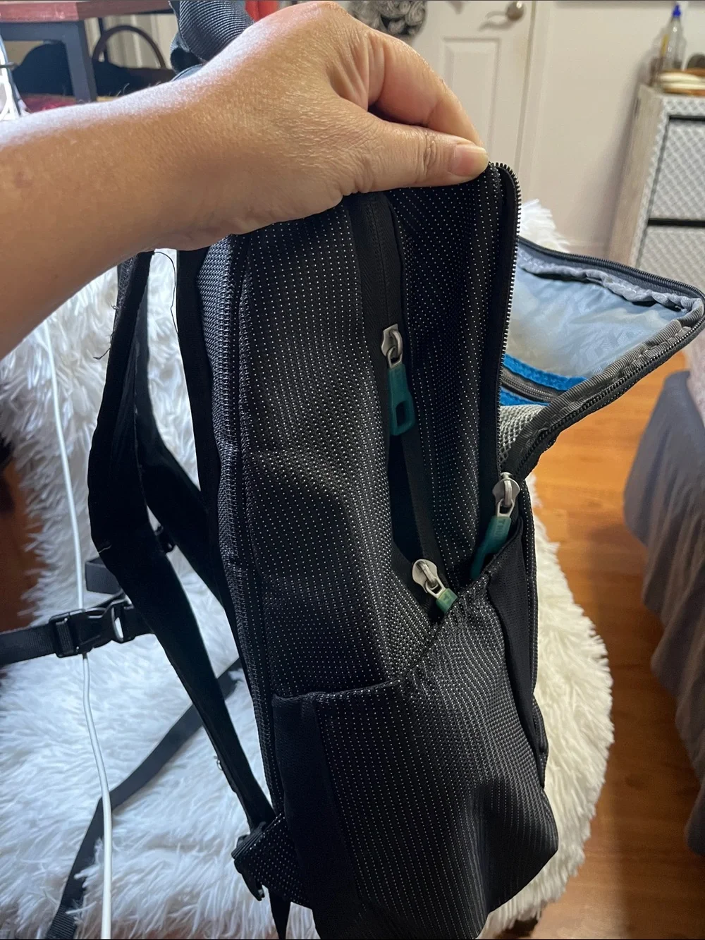 Thule Black Backpack with Teal Zipper Accents